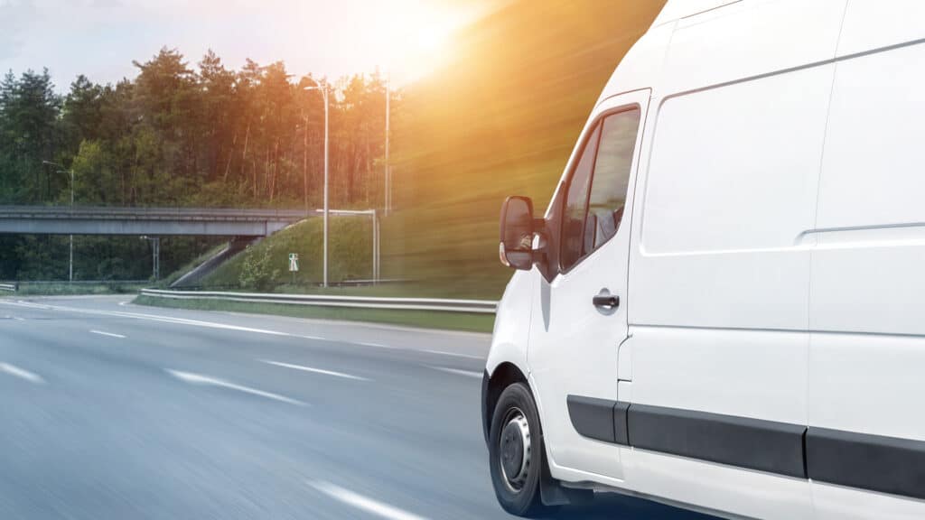 van driving down highway